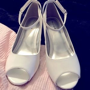 Girls open toed, kitten heels pump.